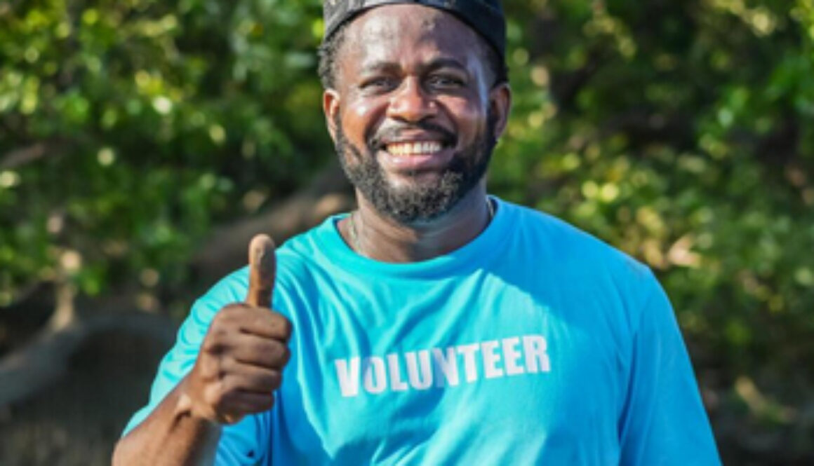 African American man in volunteer t shirt