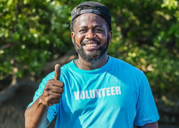 African American man in volunteer t shirt
