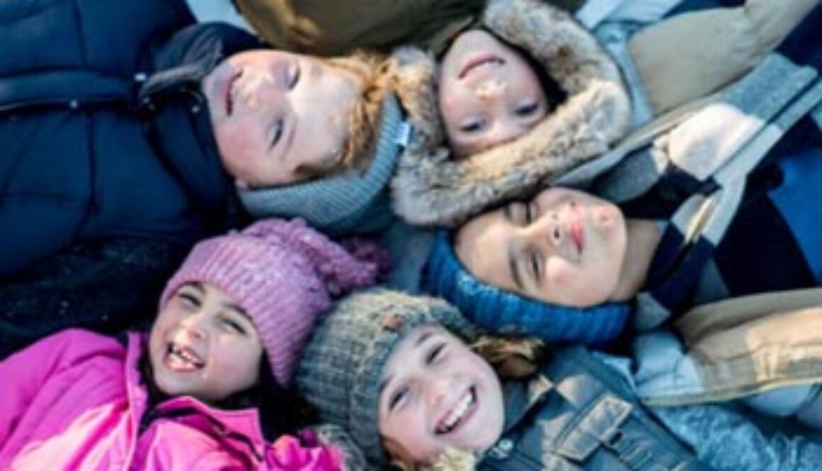 group of children with winter coats and hats