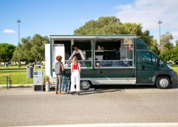 two women being served at food truck
