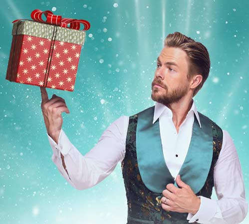 derek-hough-dance Image of Derek Hough holding present up with one finger